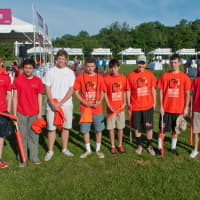 <p>The New Canaan Service League of Boys volunteer their time as course marshals.</p>