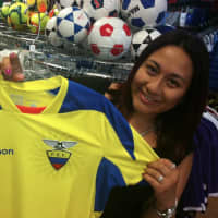 <p>Mayria Tepan, of Port Chester, N.Y., holds the jersey of Ecuador, her native country, while in Soccer Land in Stamford on Wednesday. The World Cup begins Thursday, and Ecuador is one of the countries taking part. </p>