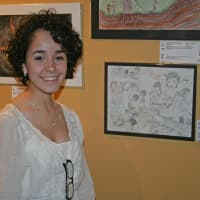 <p>Taina Pagan, 17, a student at The Center for Global Studies in Norwalk, stands by her entry, A Family Gathering, at the reception for the 18th International Childrens Art Show.</p>