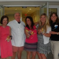 <p>Winners and judges from a bake off at Summer Kickoff Porch Party hosted by Berkshire Hathaway HomeServices New England Properties of Darien meet at the party. </p>