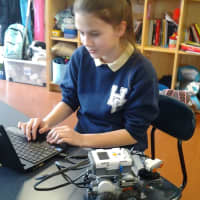 <p>Sarina Culaj works on a robotics project at the School of the Holy Child in Rye this past year. </p>