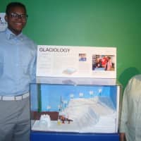<p>Amahd Young and Iris Velez with the Glaciology diorama that they created as part of the Dead Reckoners after-school program at the Maritime Aquarium in Norwalk.</p>