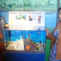 <p>Keily Caldron and Steffany Padilla with their project on marine conservation and coral reefs.</p>