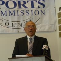 <p>Wah Chu, the father of four-time Olympian Julie Chu, speaks at an announcement Tuesday in Stamford. Julie Chu was one of seven people selected for the Fairfield County Sports Hall of Fame.</p>