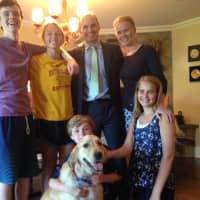 <p>Front: Kyle Pagnani, 9, and sister Kristy, 13, welcome Kooper home. Standing from left: Keith Jr., 16, Kiernan, 18, Keith (father) and Katy (mother)</p>