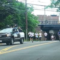 <p>Officers with the Darien Police Department take part in the Law Enforcement Torch Run for Special Olympics Connecticut.</p>