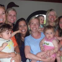 <p>Kathie Lee Gifford holds a baby while meeting women at the wine tasting at The Goose in Darien.</p>
