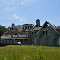 <p>The fire-damaged house at 109 Stone Bridge Lane in Bedford Hills.</p>