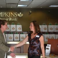 <p>Kevin Kane and Kim Arco shake hands at Tompkins Mahopac Bank&#x27;s 10th anniversary celebration for its Mount Kisco branch.</p>