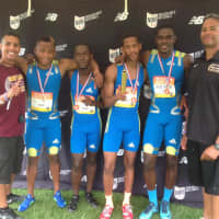 <p>Mount Vernon coach Marcus Green with his winning relay team.</p>