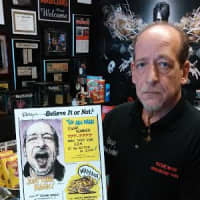 <p>Richie Magic with one of his Ripley&#x27;s Believe It Or Not Posters depicting record-breaking feats.</p>