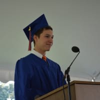 <p>Kevin Haggerty, Voice of the Class of 2014, speaks at the Horace Greeley High School graduation.</p>