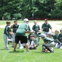 <p>Coach John Campobasso strategizes with the Yorktown Rebels.</p>
