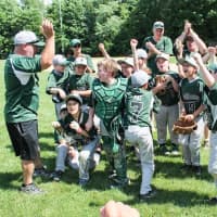 <p>The Yorktown Rebels celebrate their championship win.</p>