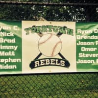 <p>The Yorktown Rebels proudly hang their team banner at the game.</p>