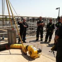 <p>Fairfield Fire Assistant Chief Scott Bisson demonstrates the haul system with Lt. Phil Higgins to fire fighter\s Matt Streibe and Ed Walsh and Lt.s Mark Harry and Joe Buoni.</p>