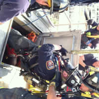<p>Lt. Phil Higgins supervises Fairfield fire fighters Rich Carlo and Rich Bassett making a Confined Space Rescue with Lt. Joe Buoni Attending and fire fighters Ed Walsh and Derek Paules working the haul system.</p>