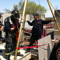 <p>Fairfield Fire fighters Derek Paules, Jerry McGuire, Nick Gentile and Rich Carlo prepare to make a Confined Space Rescue Entry under the supervision of Lt. Phil Higgins and Assistand Chief Scott Bisson.</p>