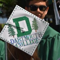 <p>A student wears a decorated hat that symbolizes her new journey to Dartmouth College. </p>