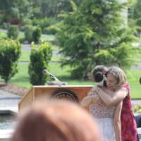 <p>Benay Umrichin embraces Emma Morello after being honored with an award.</p>