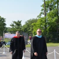 <p>Somers officials lead a procession to the graduation tent.</p>