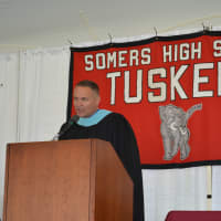 <p>Somers High School Principal Mark Bayer speaks at the  commencement</p>