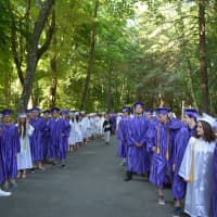 <p>Members of John Jay High School&#x27;s 2014 class line up for their commencement.</p>