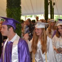 <p>Members of John Jay High School&#x27;s 2014 class go to the stage for their commencement.</p>
