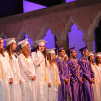 <p>Members of John Jay High School&#x27;s Class of 2014 stand at the start of their commencement.</p>