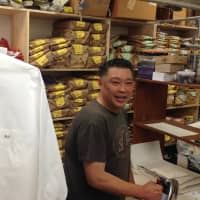 <p>Eric Moy irons shirts on a beautiful weekday in downtown Rye. </p>