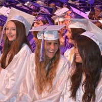 <p>Smiling members of John Jay High School&#x27;s Class of 2014 at their commencement.</p>