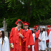 <p>Members of Fox Lane High School&#x27;s Class of 2014 proceed to their commencement.</p>