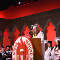 <p>Master of Ceremonies Lauren Raue speaks at Fox Lane High School&#x27;s 2014 commencement.</p>