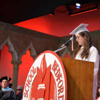<p>Valedictorian Charlotte Herber delivers her address.</p>