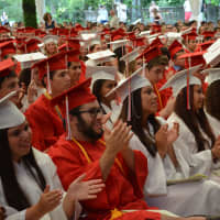 <p>Fox Lane High School&#x27;s Class of 2014 members applaud at their commencement.</p>