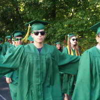 <p>Hastings High School graduates march on to Reynolds Field Thursday, June 26.</p>