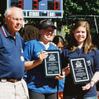 <p>Emma Moskovitz and Katherine Friend receive Westport Softball&#x27;s John Ward in 2010 from Bill Meyer, left, and Steve Axthelm.</p>