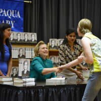 <p>Hillary Clinton shook hands with several visitors at her Chappaqua Library book signing.</p>