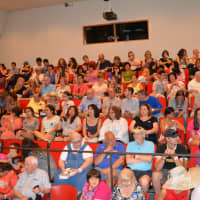 <p>Turnout was high for Hillary Clinton&#x27;s Chappaqua Library book signing. A large crowd is pictured in the theater, where the signing was held.</p>