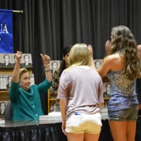 <p>Hillary Clinton gives a thumbs up at her Chappaqua Library book signing.</p>