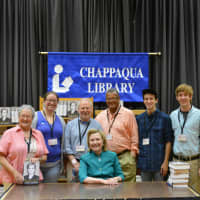 <p>Hillary Clinton poses with The Village Bookstore staff.</p>