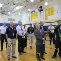 <p>Officials watch the drill unfold at Walter Panas High School.</p>