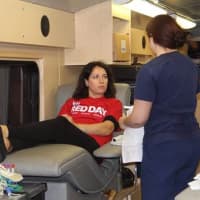 <p>Keller Williams Scarsdale agent Kristina Mernaci prepares to donate blood as part of the agencys Red Day community service project. </p>