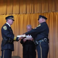 <p>Fairfield Detective George Buckmir is sworn in by Fairfield First Selectman Michael Tetreau and Deputy Chief Chis Lyddy. </p>