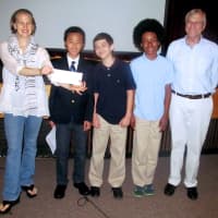<p>Josh Xiang, Dawson Byrd, and Daniel Kornbluth donate a check to Lissy Newman and Dan Kail from the Hole in the Wall Gang Camp.</p>