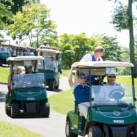 <p>Golfers take off to their starting holes.</p>