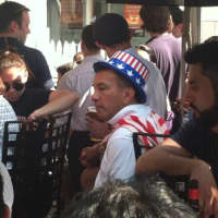 <p>A U.S. fan takes a moment to relax during a break in the U.S. - Belgium World Cup game. The fan was among the crowd at Tigin, an Irish bar on Bedford Street.</p>