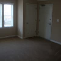 <p>The living room of one of the two-bedroom homes at the Heights at Darien.</p>