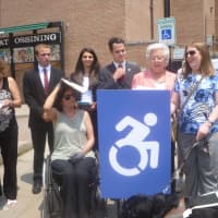 <p>Assemblywoman Sandy Galef and state Sen. David Carlucci show off the new accessible signs in Ossining. </p>