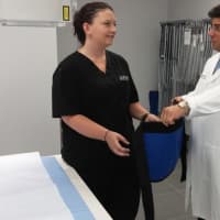 <p>CityMD&#x27;s Dr. Frank Illuzzi works with a staffer in the x-ray room at the new Yonkers facility.</p>